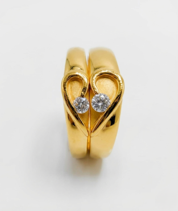 gold solitaire couple ring